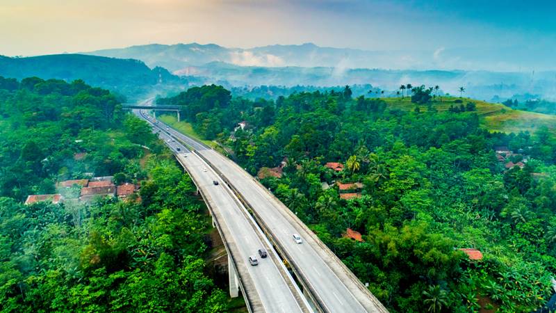 Aerial,View,Of,Toll,Bridge,Between,Hills,In,Indonesia,,Cikubang,